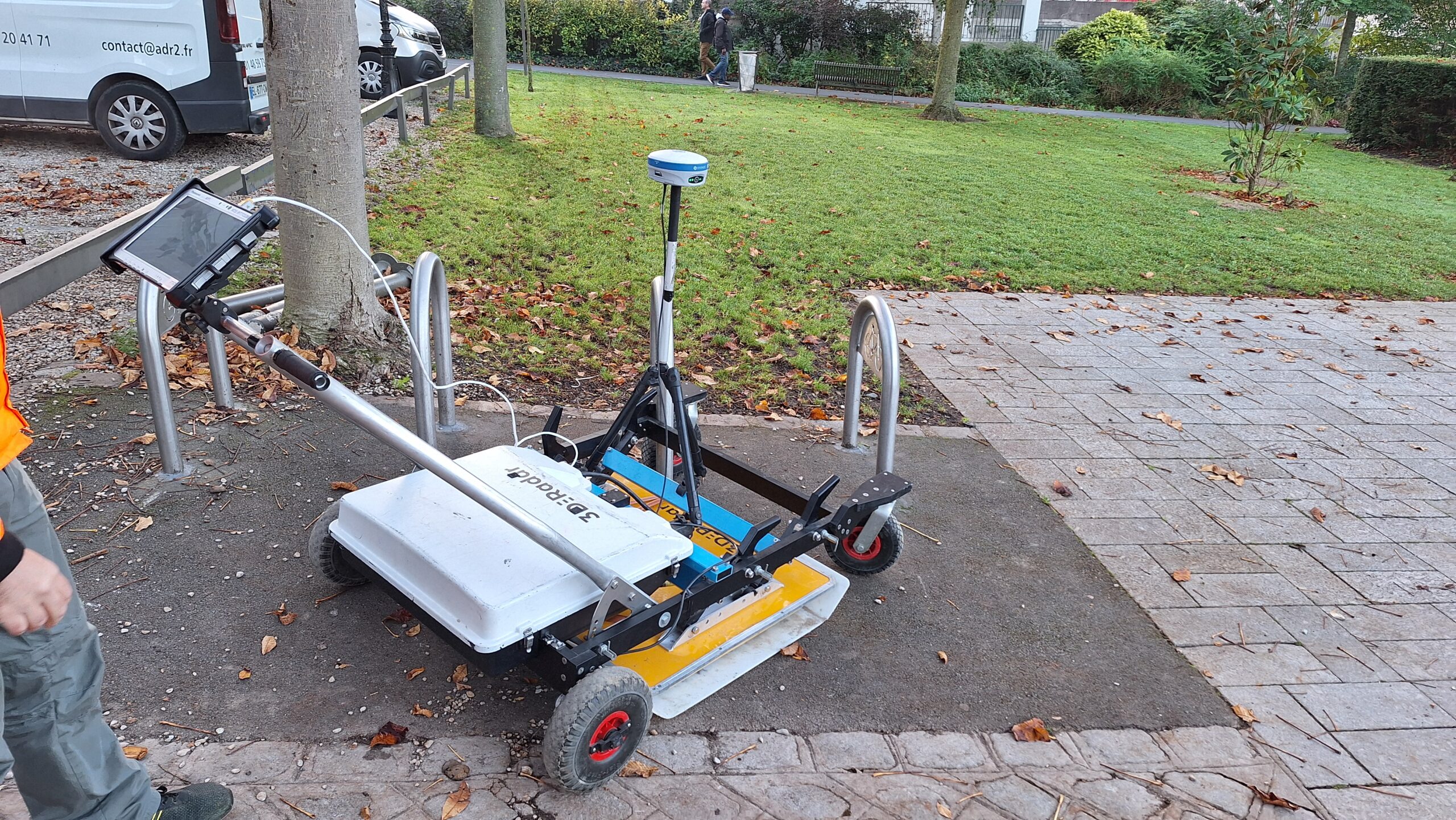 a set of train tracks next to a train station