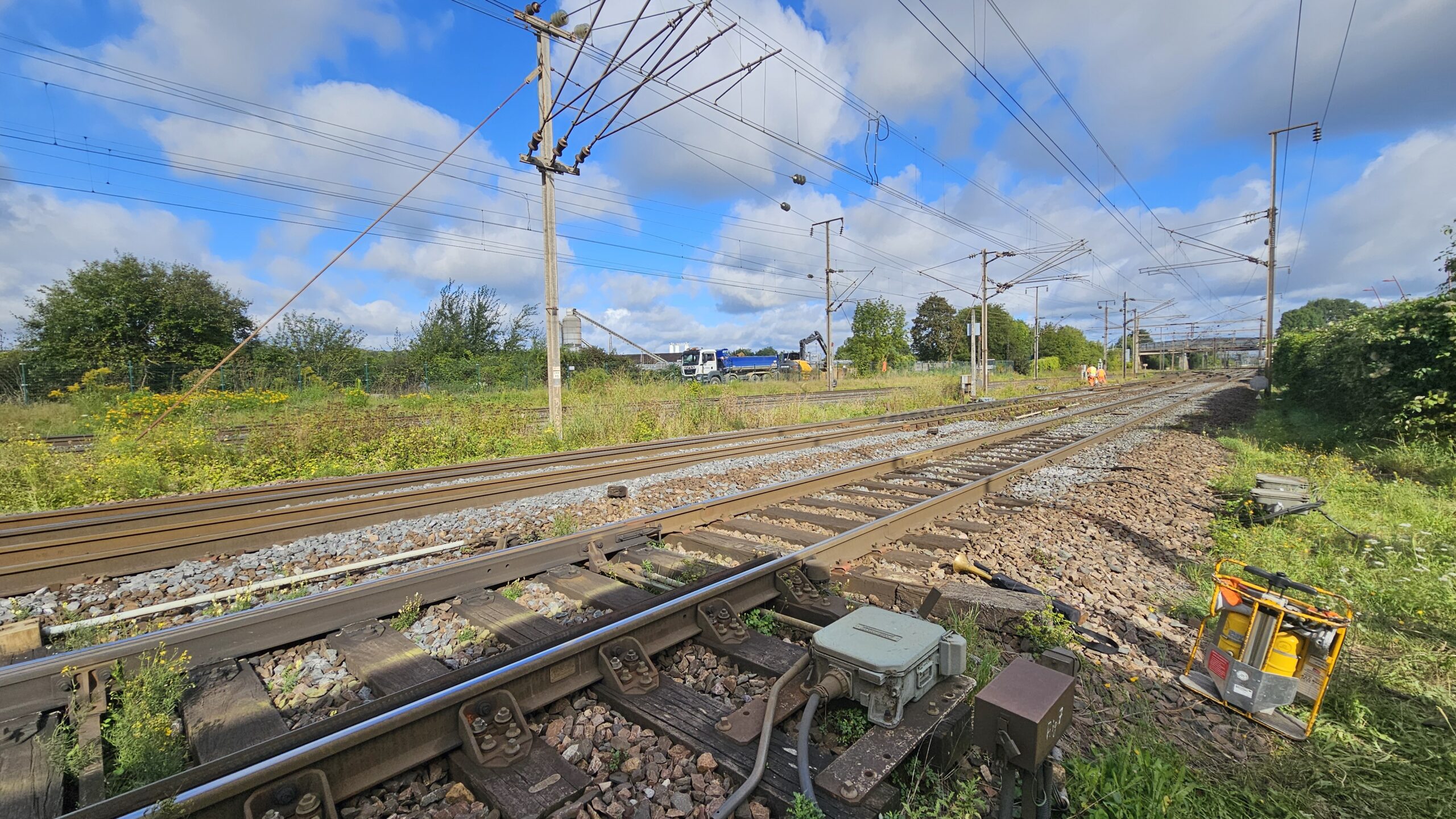 a set of train tracks next to a train station