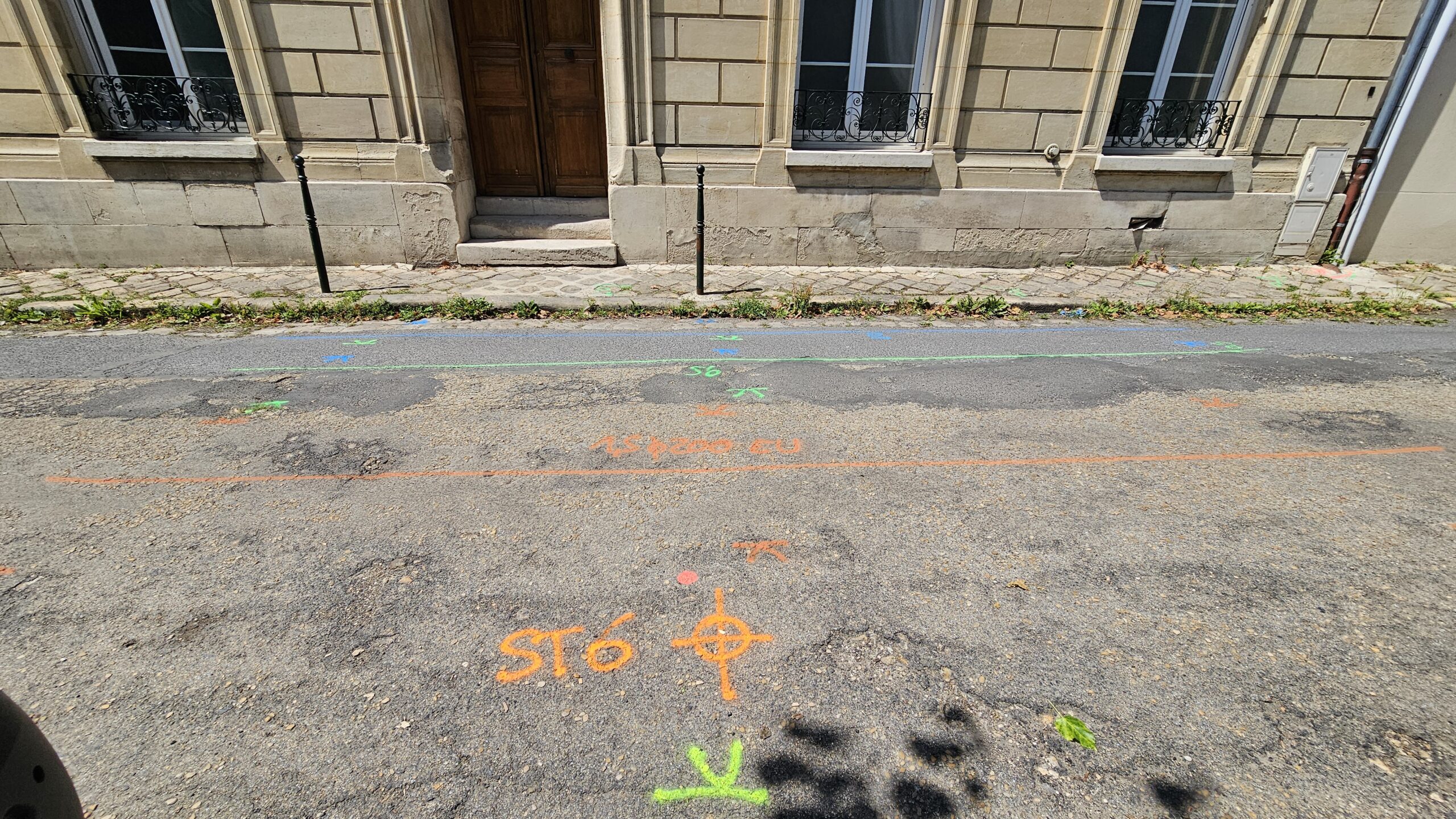 a set of train tracks next to a train station